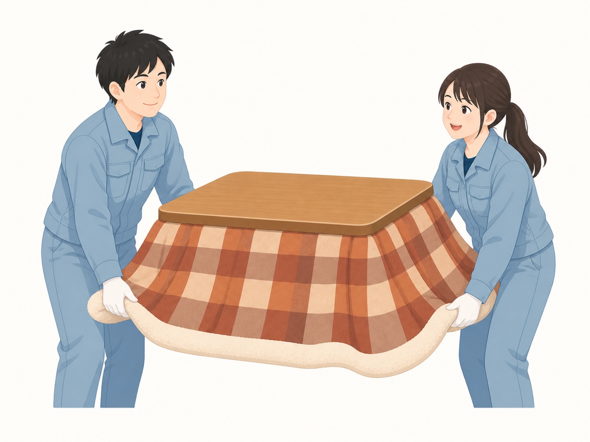 こたつをプロのスタッフが運び出す様子
